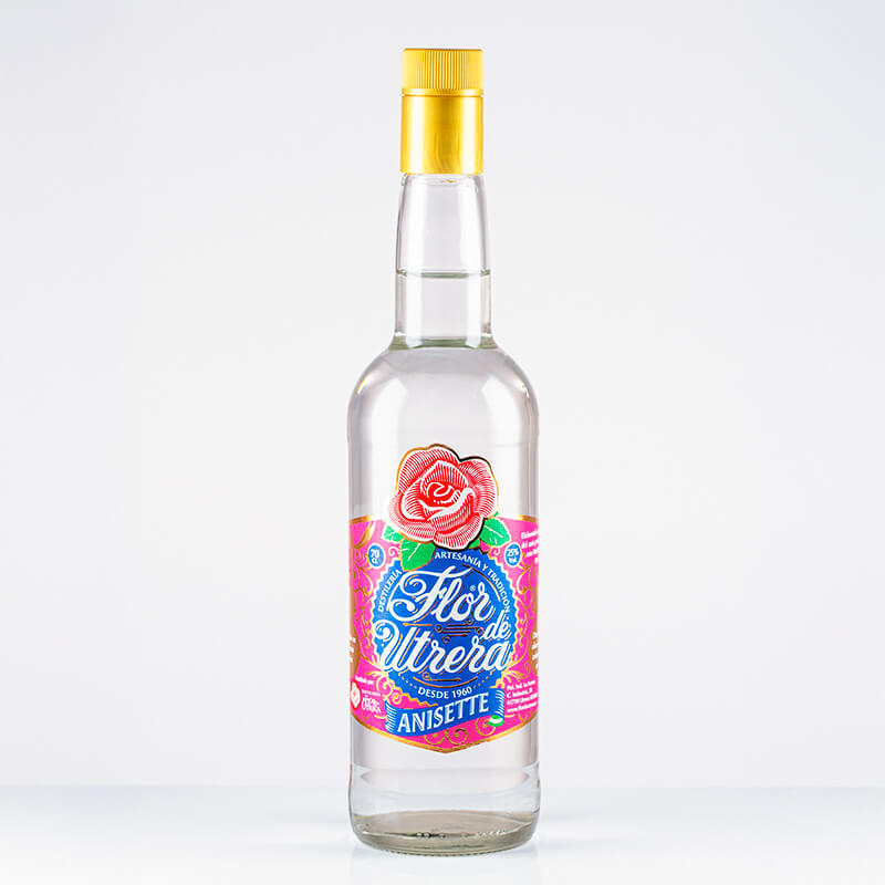 Botella de anís Flor de Utrera Anisette con etiqueta rosa y fondo blanco